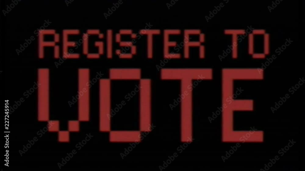 Analog VHS tape distortion: a flashing text with the words Register to vote. Red on black, blocky 8-bit characters, faded color tone.
Analog VHS tape distortion: a flashing text with the words Register to vote. Red on black, blocky 8-bit characters, faded color tone.