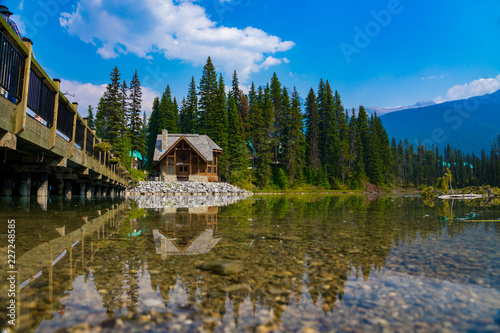 A house with a lake with reflection