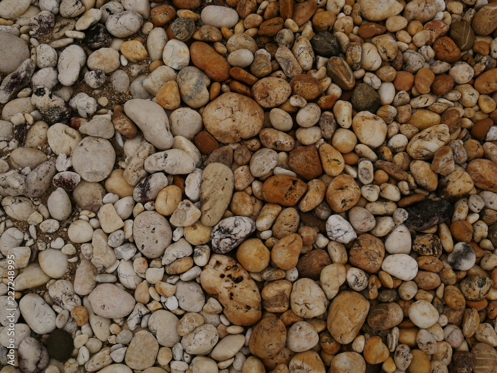 pebbles on the beach,stone concrete wall background pebbles on the beach,stone concrete wall background