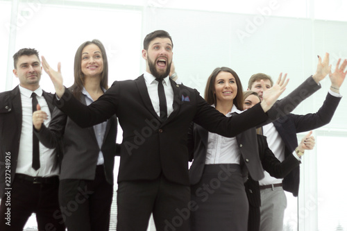 Valokuva close up. triumphant business team on office background