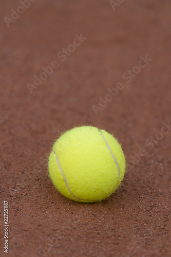 Tennis ball on a tennis clay court © Augustas Cetkauskas