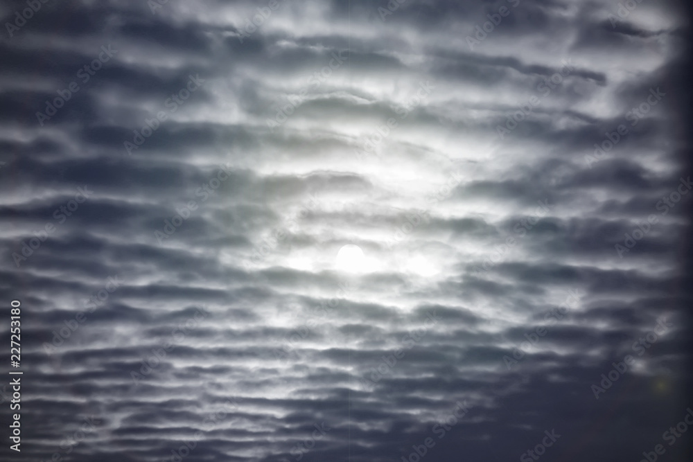 Textured clouds in the night sky
