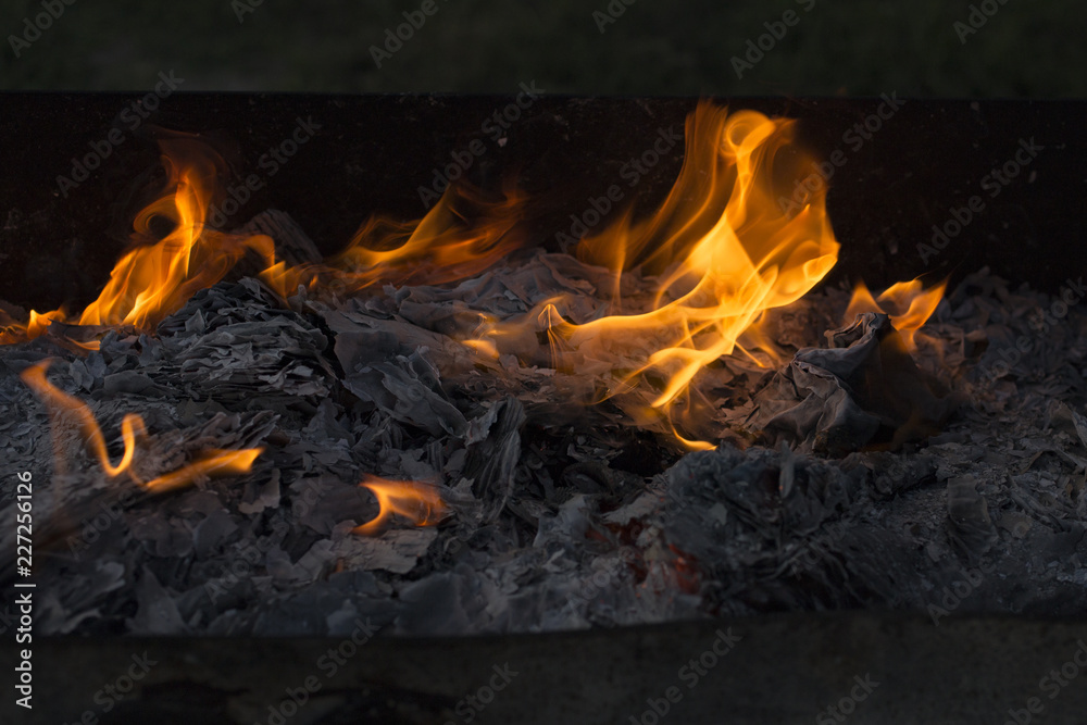Flaming fire. Documents burning. Dance of fire spirits. Ignition of paper. Flaming fire. Documents burning. Dance of fire spirits. Ignition of paper.