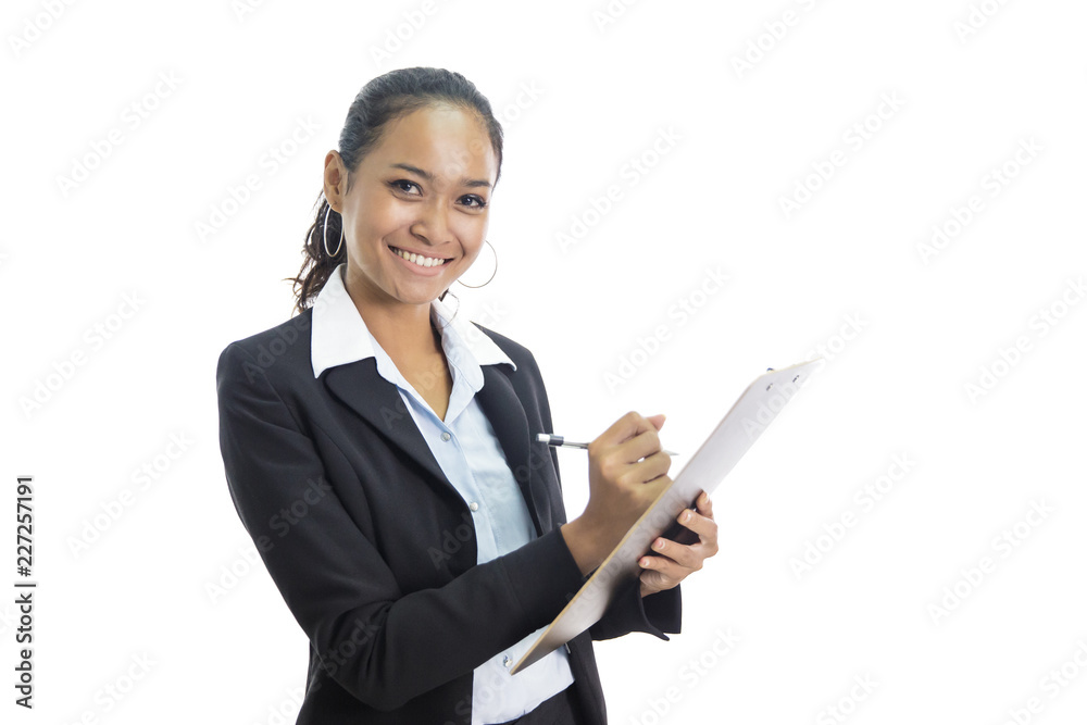 young busineswoman writing report while standing and smiling young busineswoman writing report while standing and smiling