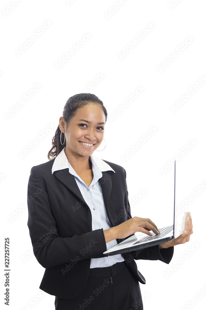 young business woman working on her laptop while standing young business woman working on her laptop while standing