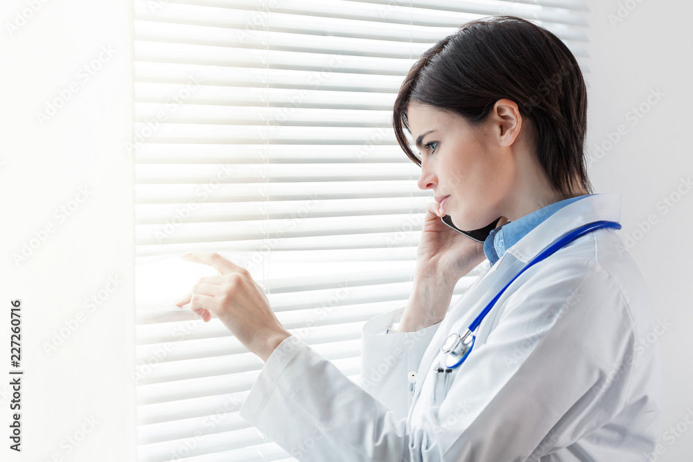 Concerned thoughtful woman doctor Concerned thoughtful woman doctor