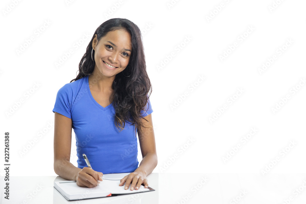 casual college student studying and writing on notebook casual college student studying and writing on notebook