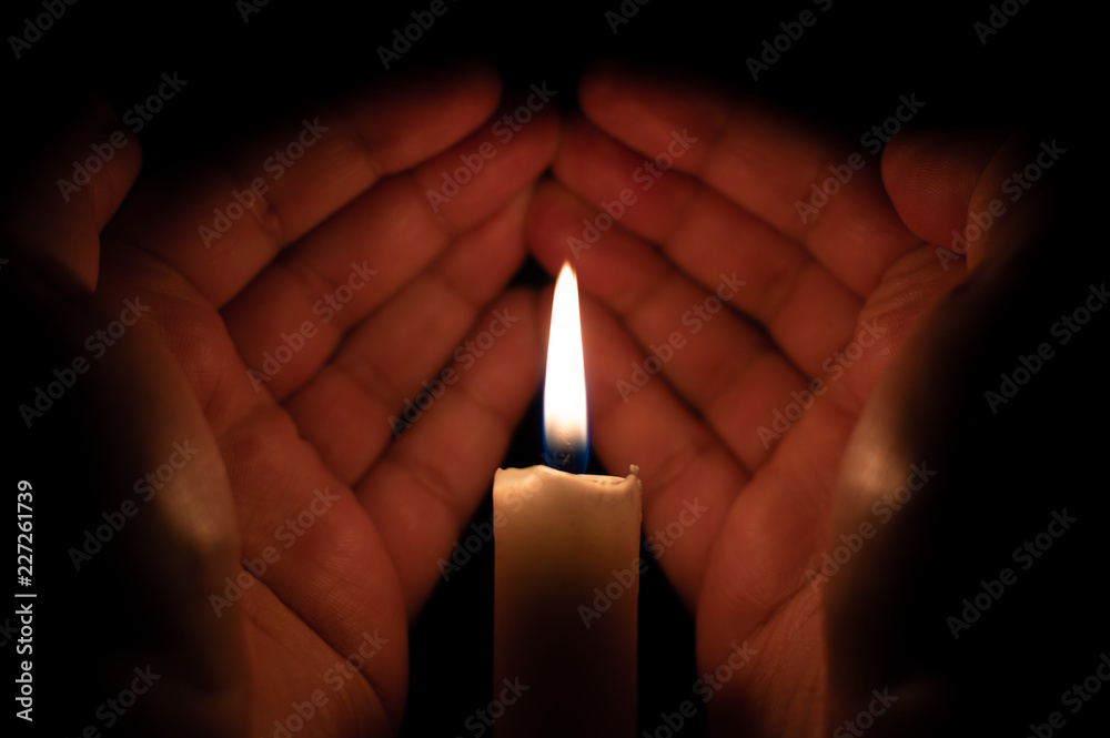 Hands raised for prayer Muslim supplication candle light Hands raised for prayer Muslim supplication candle light
