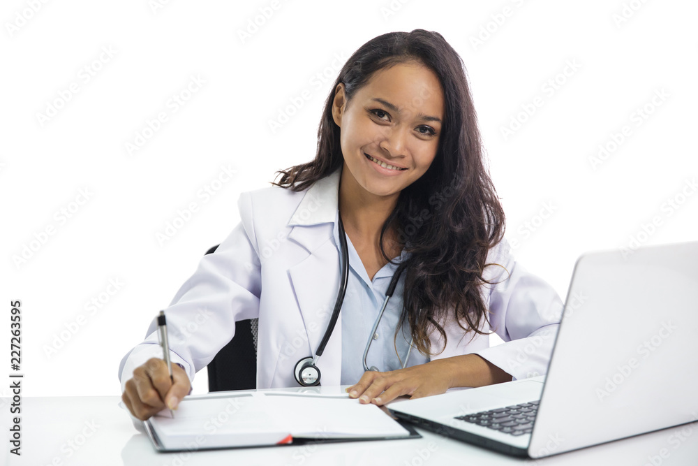 beautiful young doctor working on her laptop and writing on note beautiful young doctor working on her laptop and writing on note