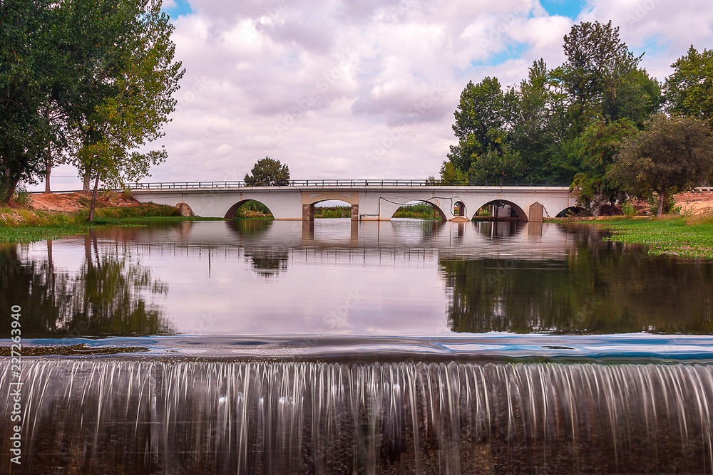 Landscape Of a Bridge Over a River Under a Beautiful Sky