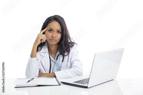asian young doctor with flat expression while sitting on her wo