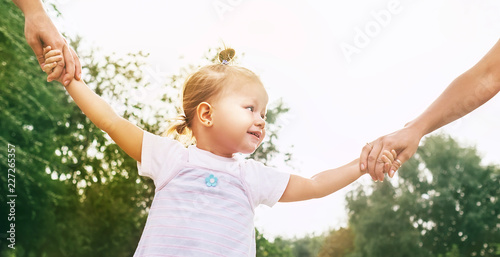 Little Cute girl take hands with her relatives people