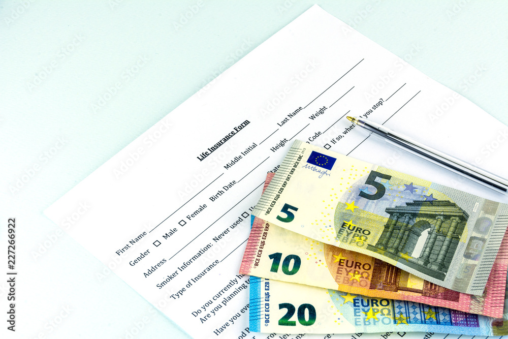Life insurance form. A few pills and bills on the sheet. Cash banknote euro. Life insurance form. A few pills and bills on the sheet. Cash banknote euro.