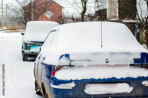Cars covered in snow. Deterioration of weather conditions, blizzards_