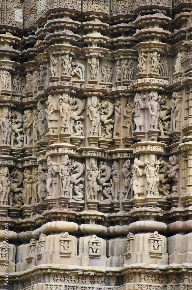 DEVI JAGDAMBI TEMPLE, Wall - Deities surrounded by surasundaries in various poses and Vyalas, Western Group, Khajuraho, Madhya Pradesh, UNESCO World Heritage Site