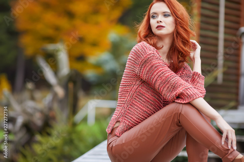 Romantic Autumn Woman Model with Red Hair, with Fall Fashion Girl Outdoors