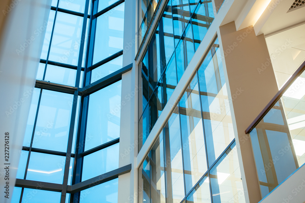 Modern blue glass wall of office building Modern blue glass wall of office building