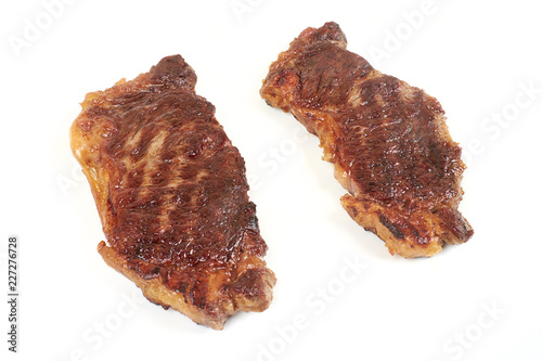 Delicious fried meat steak isolated on white background