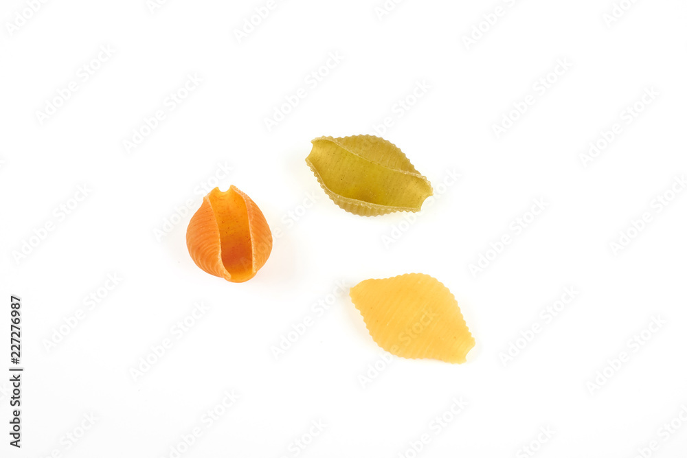 conchiglie paste of different colors isolated on white background conchiglie paste of different colors isolated on white background