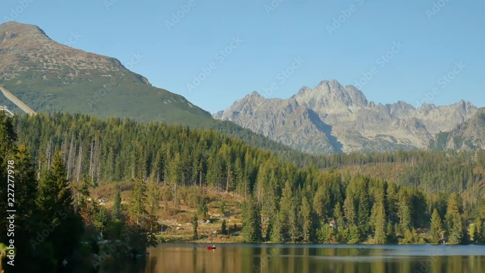 Left to right pan at Strbske Pleso, overlooking surround mountains and forests and landmarks of this area (High Tatra, Slovakia). Left to right pan at Strbske Pleso, overlooking surround mountains and forests and landmarks of this area (High Tatra, Slovakia).