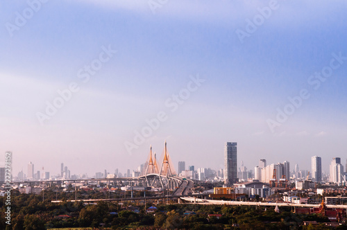 Bangkok skyline cityscape and King Bhumibol bridge or Industrial ring road bridge.