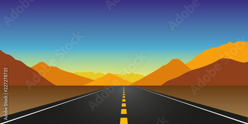 straight asphalt road in autumn in the mountains landscape