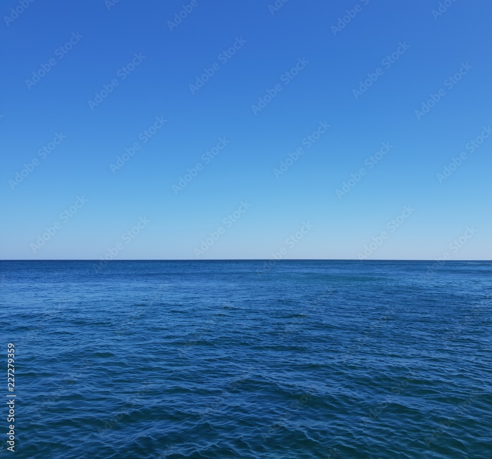 View of Santorini Aegean sea with stunning blue sky