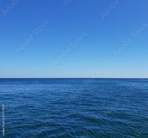 View of Santorini Aegean sea with stunning blue sky