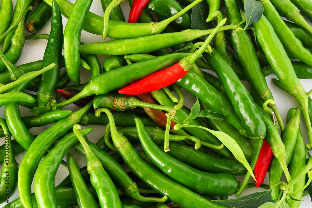 garden fresh green and red chili pepper in white background garden fresh green and red chili pepper in white background