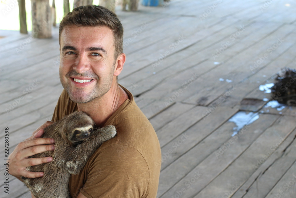 Obraz premium Handsome man working in animal shelter