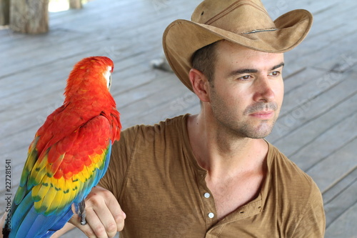 Man interacting with a gorgeous macaw bird