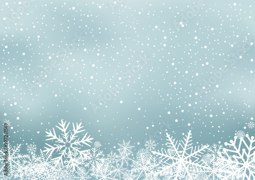 Winter holiday background with snow. Frosty close-up wintry snowflakes. Ice shape pattern. Christmas decoration backdrop