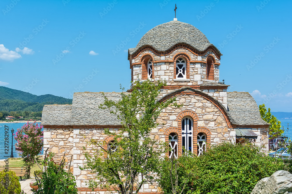 Olympiada, Greece - August 18, 2018: St. Nicholas church at the beach of the town Olympiada in Chalkidiki in Greece