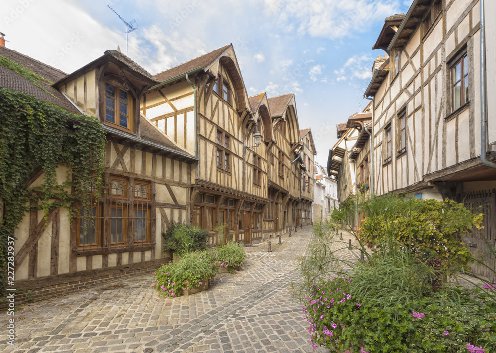Alley with medieval houses at the old town of Troyes, Fracne