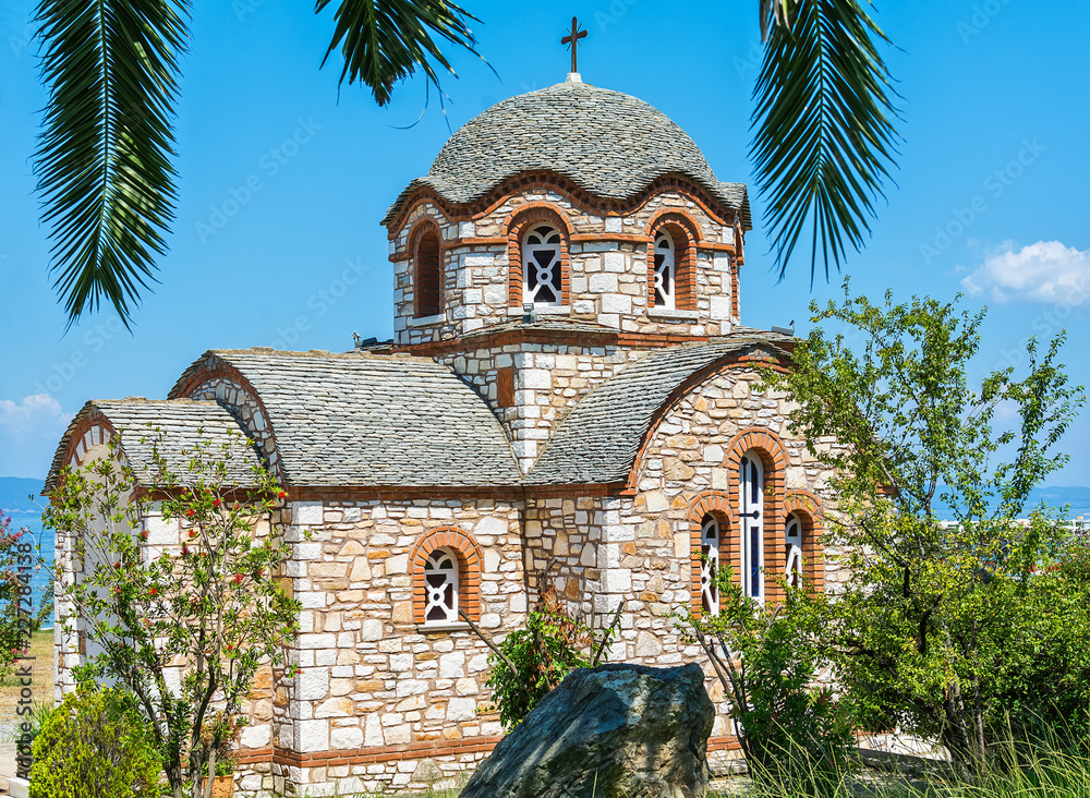 Fototapeta premium Olympiada, Greece - August 18, 2018: St. Nicholas church at the beach of the town Olympiada in Chalkidiki in Greece