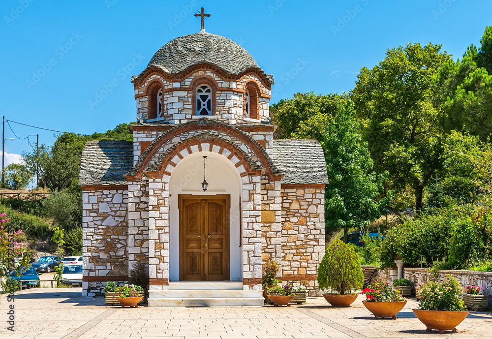 Fototapeta premium Olympiada, Greece - August 18, 2018: St. Nicholas church at the beach of the town Olympiada in Chalkidiki in Greece