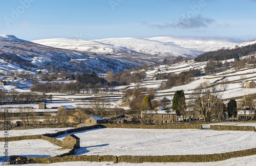 The barns at Gunnerside in Swaledale on a bright, snowy winter's day