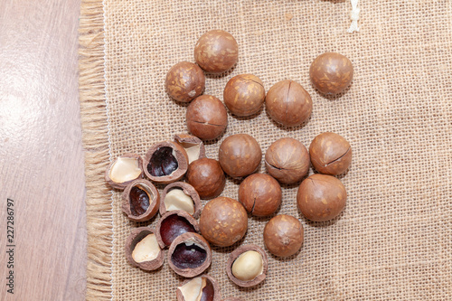 close up of organic macadamia nut on sack