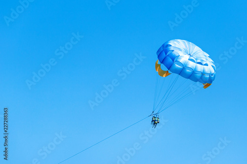 Parasailing on beach in summer. 