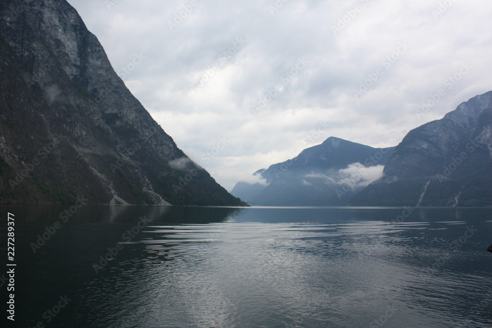 Landscape fjord, mountains, water flows, Norway