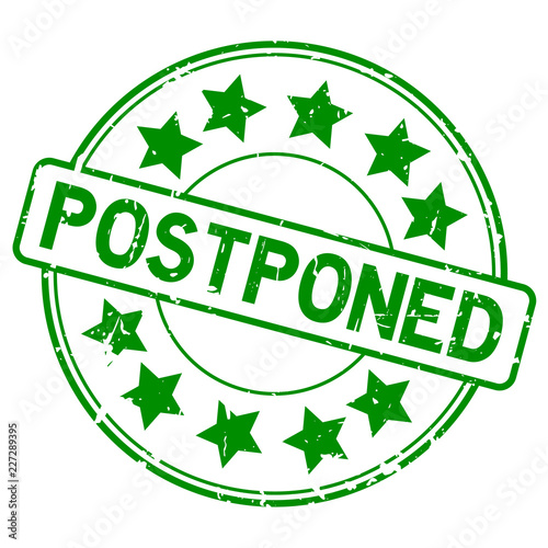 Grunge green postpone round rubber seal stamp on white background