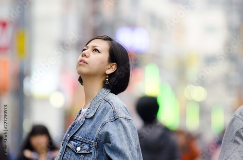 Japanese Girl poses on the street in Machida, Japan. Machida is an area located in Tokyo. photo