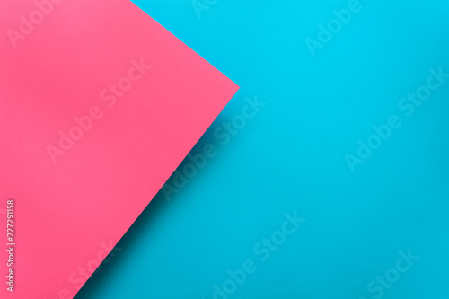 Blue and pink pastel color papered background. Volume geometric flat lay. Top view. Copy space