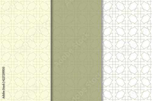 Olive green and white geometric ornaments. Set of seamless patterns
