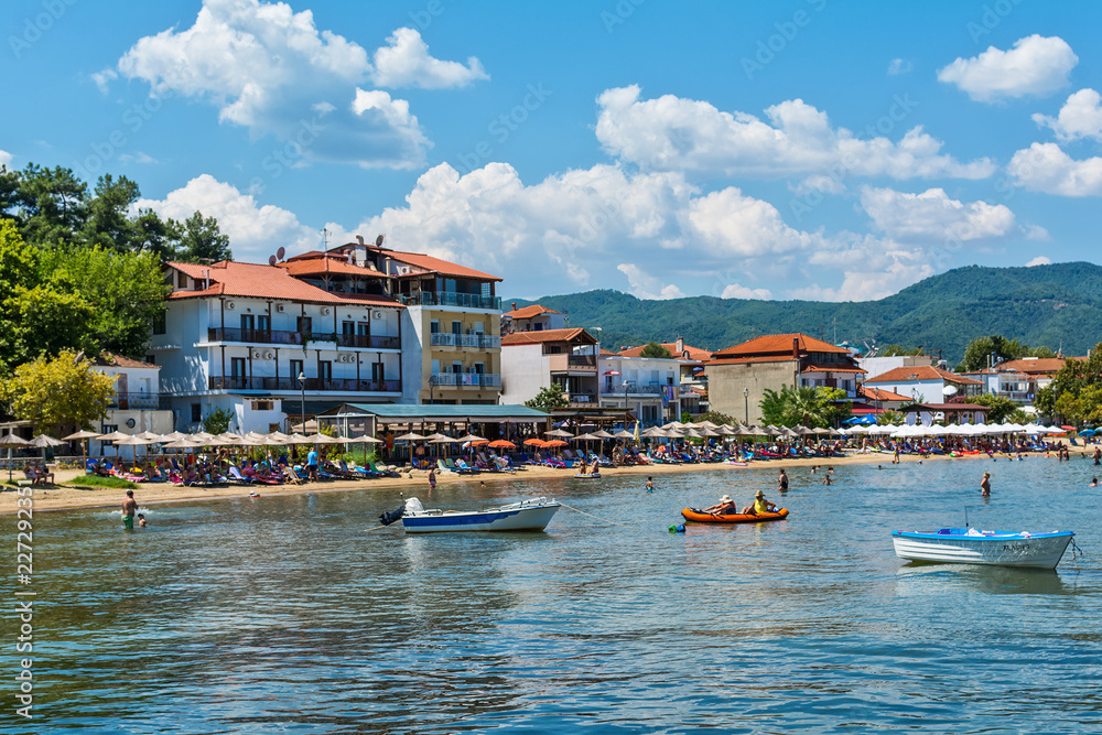 Fototapeta premium Olympiada, Greece - August 18, 2018: Beach of Olimpiada town at Chalkidiki, Greece