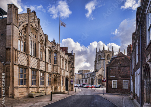 Quadro su tela The Town Hall and Trinity Guildhall, Kings Lynn, Norfolk, England, UK, looking towards King's Lynn Minster