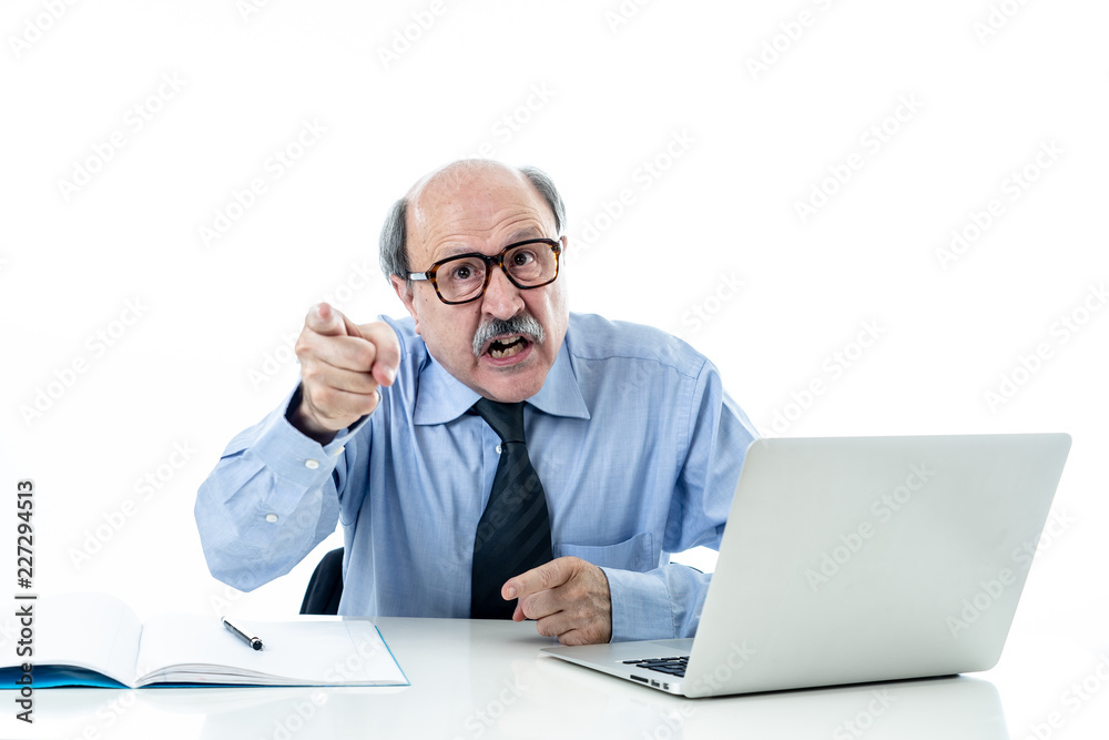 Angry older boss at work yelling and arguing at office Angry older boss at work yelling and arguing at office