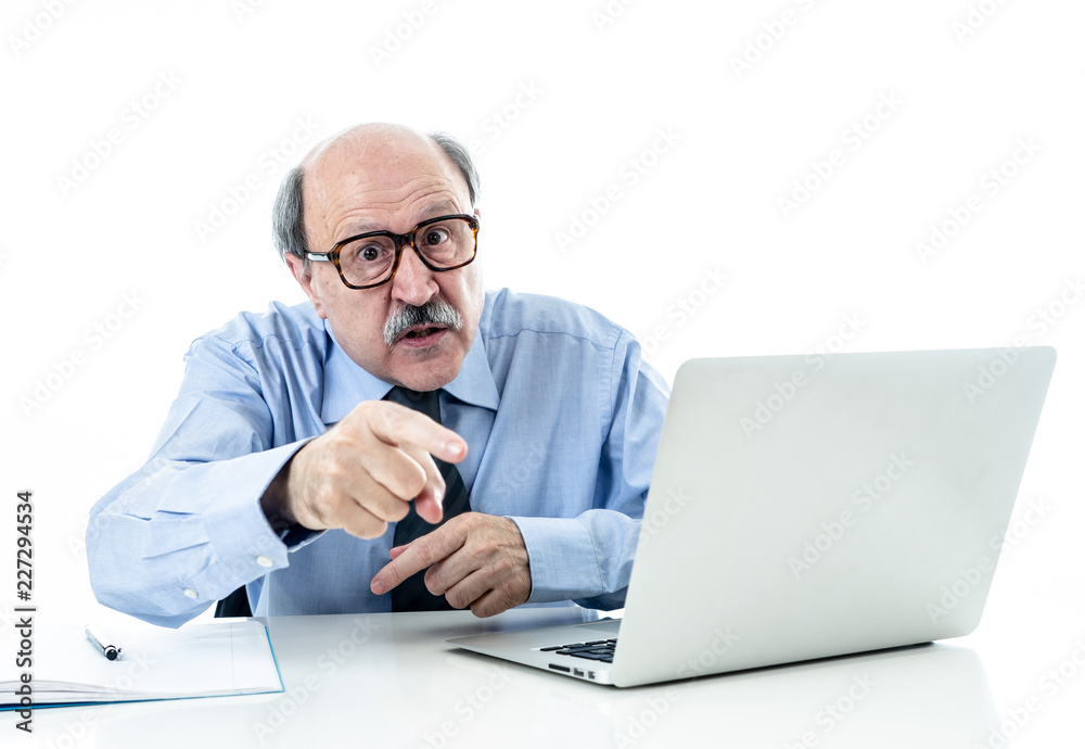 Angry older boss at work yelling and arguing at office Angry older boss at work yelling and arguing at office
