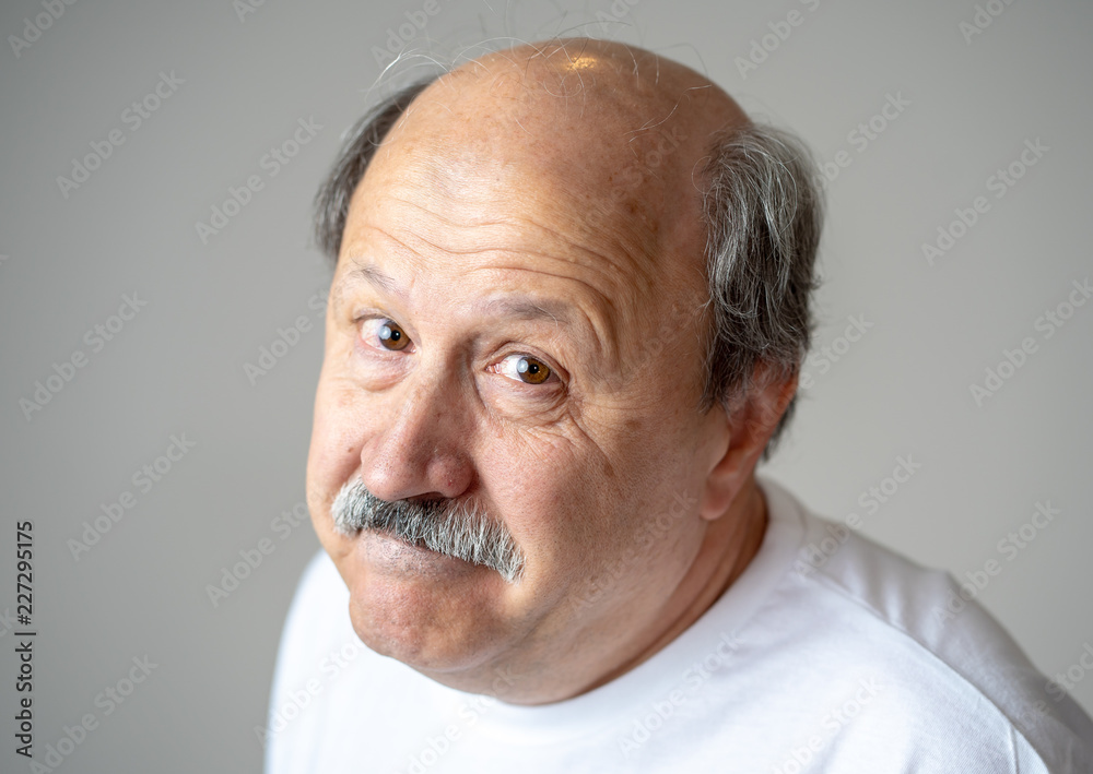 Close up portrait of sad old man face suffering from depression Close up portrait of sad old man face suffering from depression