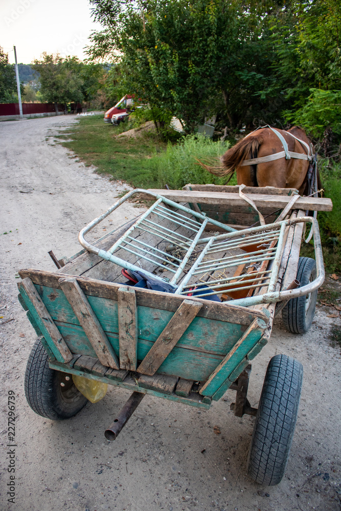 Cart with horse full of old stuff